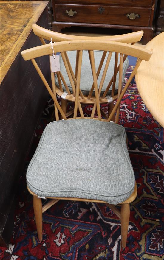 A set of four Ercol light elm candlestick chairs